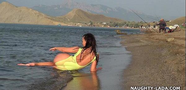  Transparent swimsuit and nude on the beach